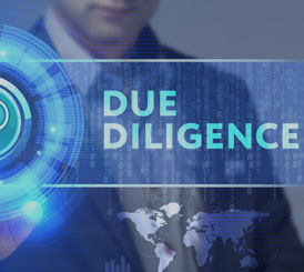 A man is holding a button with the word due diligence on it while providing Proposal Support for the Federal Government.